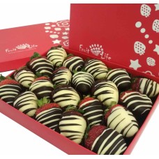 Strawberries in black and white chocolate with stripes